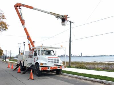 emergency service truck working on power lines