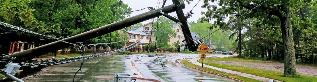 photo of downed powerlines on a wet road